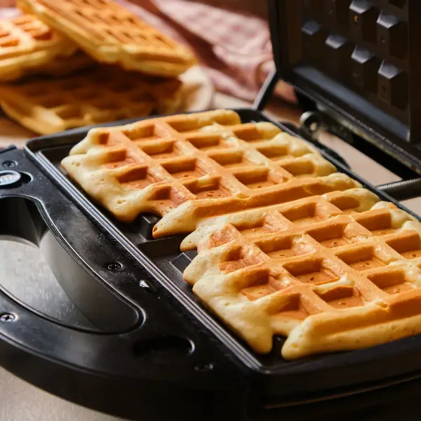 A waffle made in a waffle maker during a corporate waffle-making event