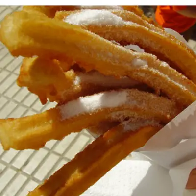 Sugar-coated churros served during a churros bar event at a company