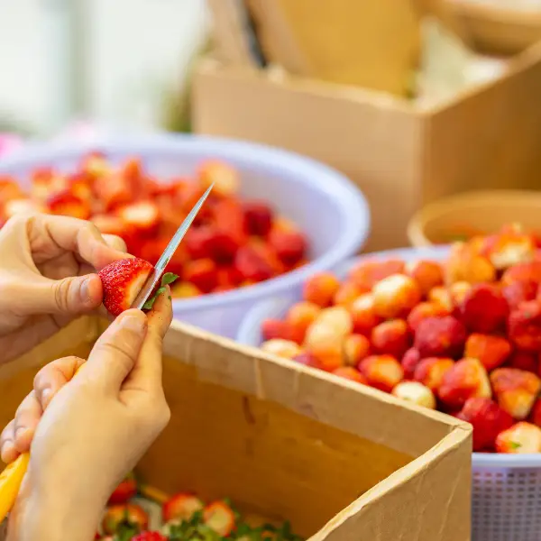 Fruit cutting during a juice bar event