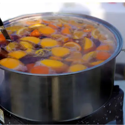 Preparing mulled wine during a corporate mulled wine bar event