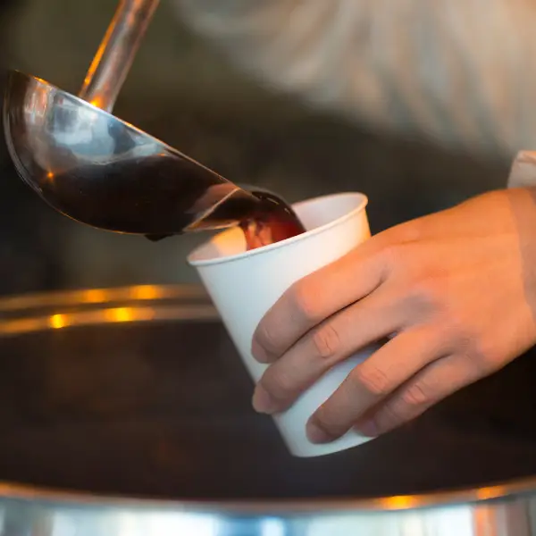 Mulled wine service during a corporate mulled wine bar event