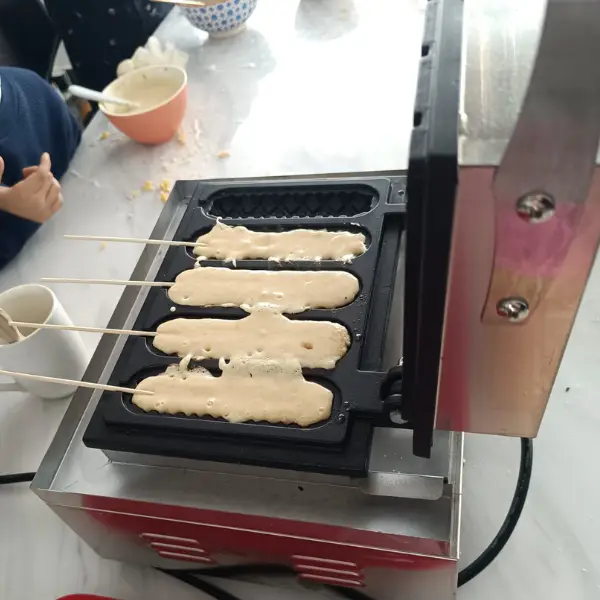 Preparing lollipop waffles during a lollipop waffle event at a company