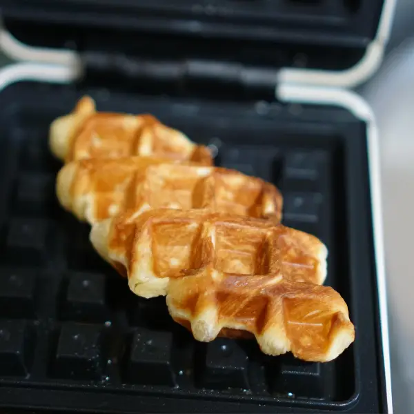 Lollipop waffles made on a waffle iron during a corporate lollipop waffle event