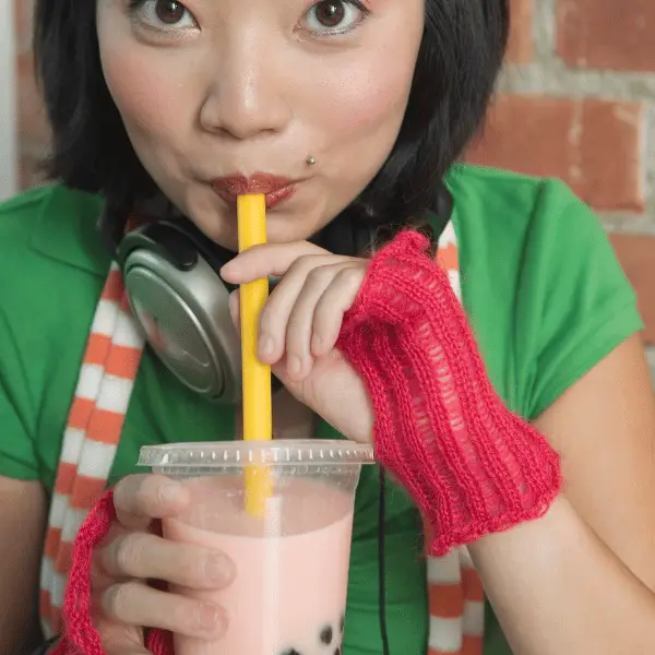 A person drinking bubble tea during a corporate bubble tea bar event